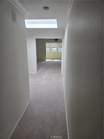 a spacious bathroom with a double vanity sink a mirror and a shower