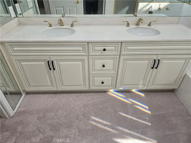 a view of a patio with table and chairs potted plants with floor to ceiling window