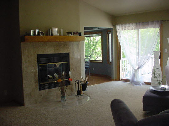 3353 North Trainer Road Rockford, IL 61114 - Photo 4 of 6 a living room with furniture and a fireplace