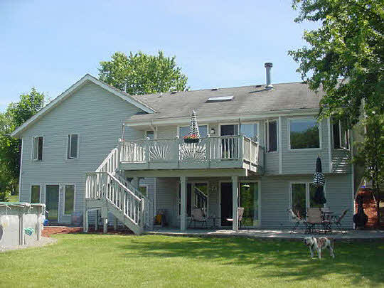 3353 North Trainer Road Rockford, IL 61114 - Photo 5 of 6 a front view of house with yard and outdoor seating