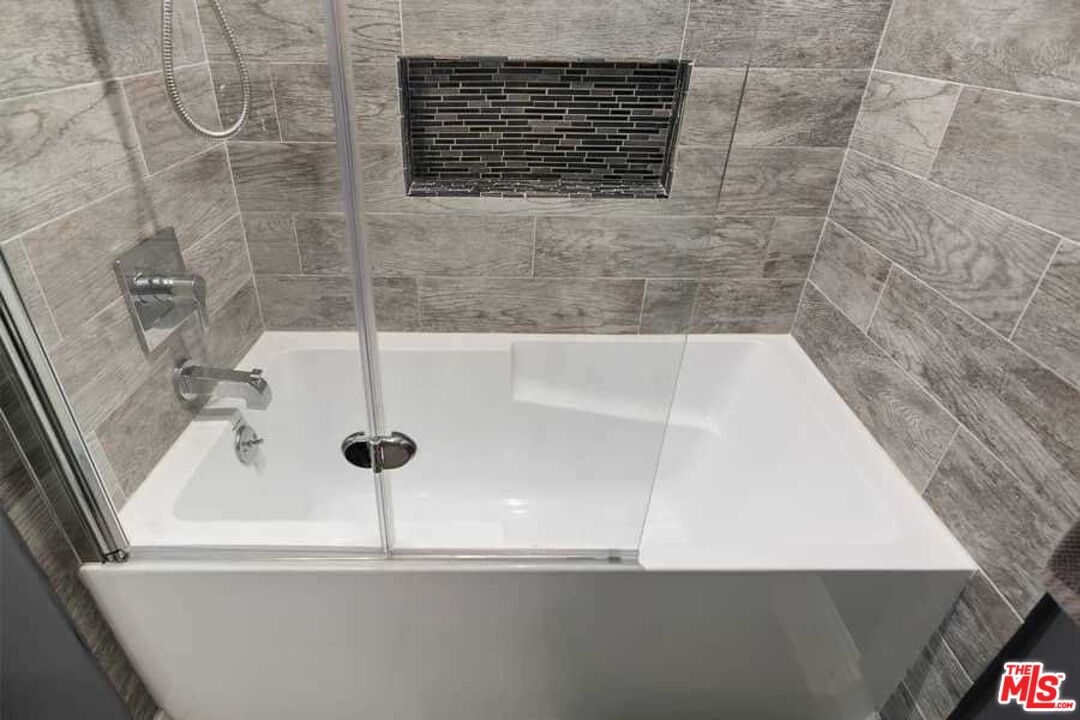 8460 Hatillo Avenue Winnetka, CA 91306 - Photo 12 of 19 a bathroom with a bathtub