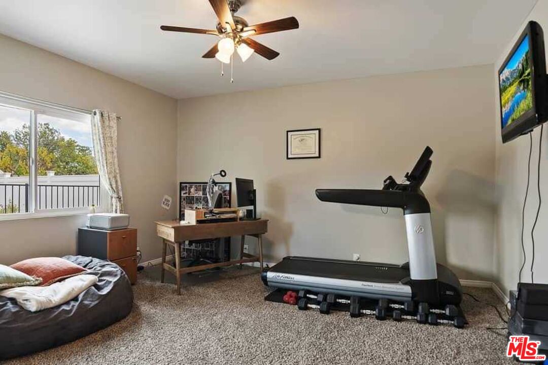 8460 Hatillo Avenue Winnetka, CA 91306 - Photo 14 of 19 a bedroom with furniture and a window