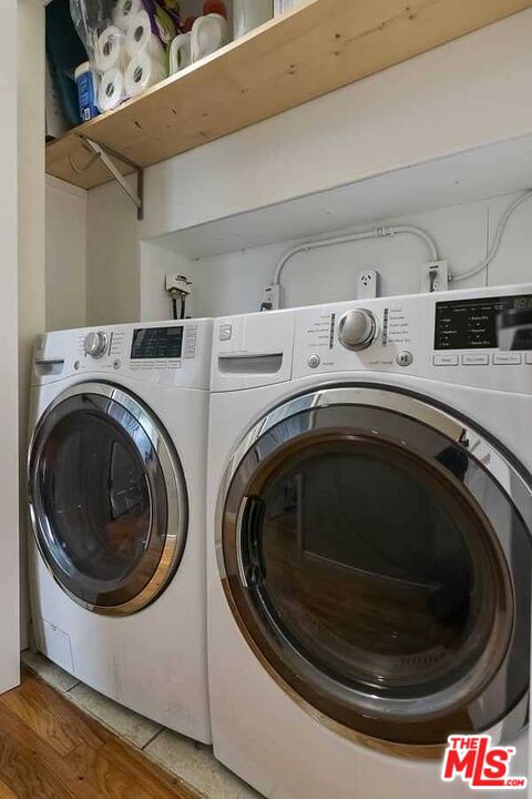 8460 Hatillo Avenue Winnetka, CA 91306 - Photo 15 of 19 a utility room with dryer and washer