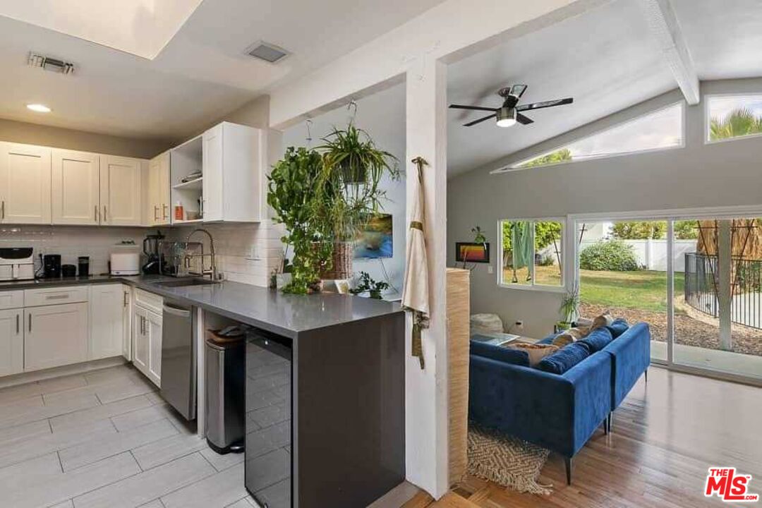 8460 Hatillo Avenue Winnetka, CA 91306 - Photo 3 of 19 a kitchen with granite countertop lots of counter top space