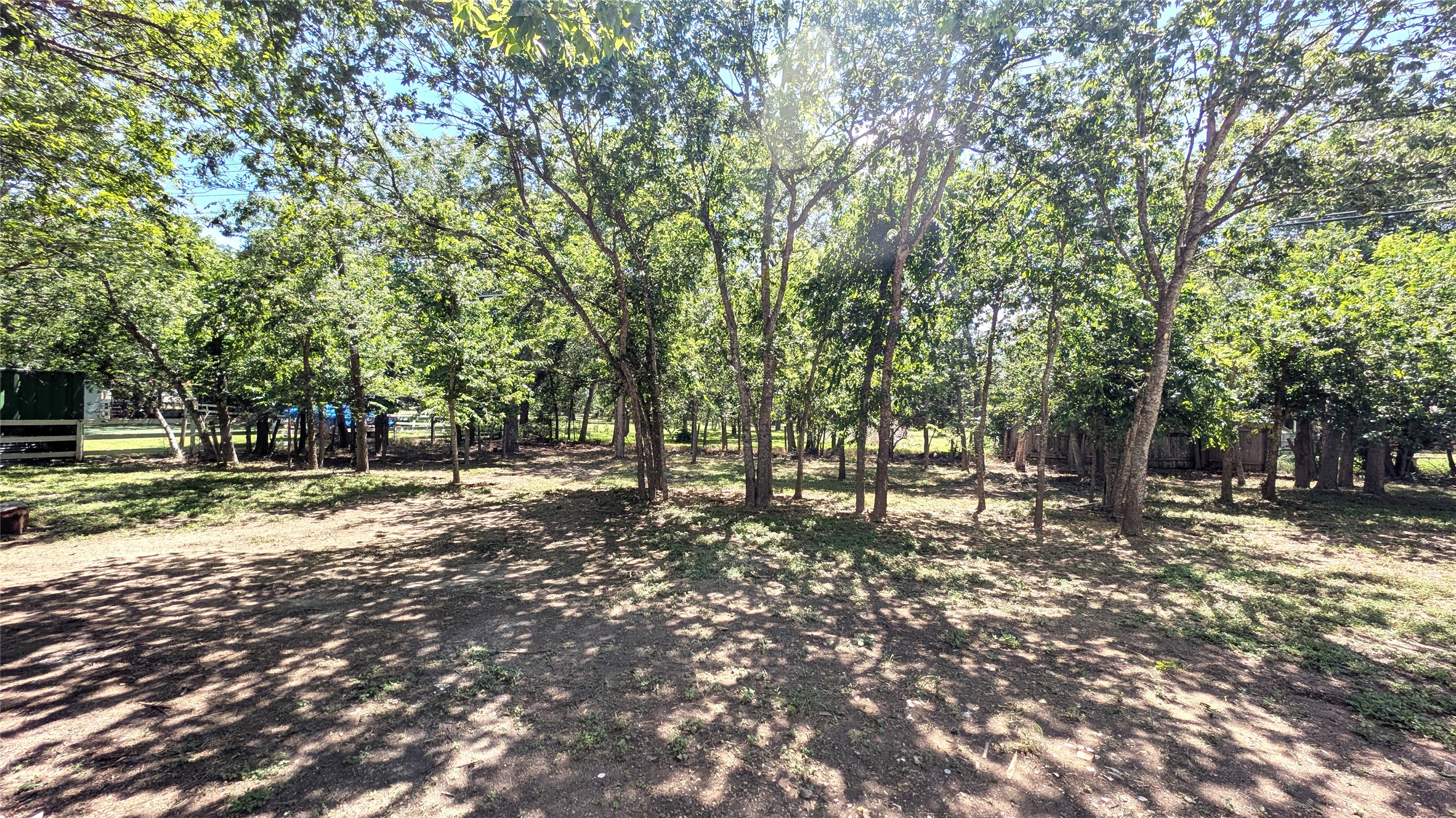 11811 Sleepy Hollow Road Manchaca, TX 78652 - Photo 27 of 31 a backyard of a house with lots of trees