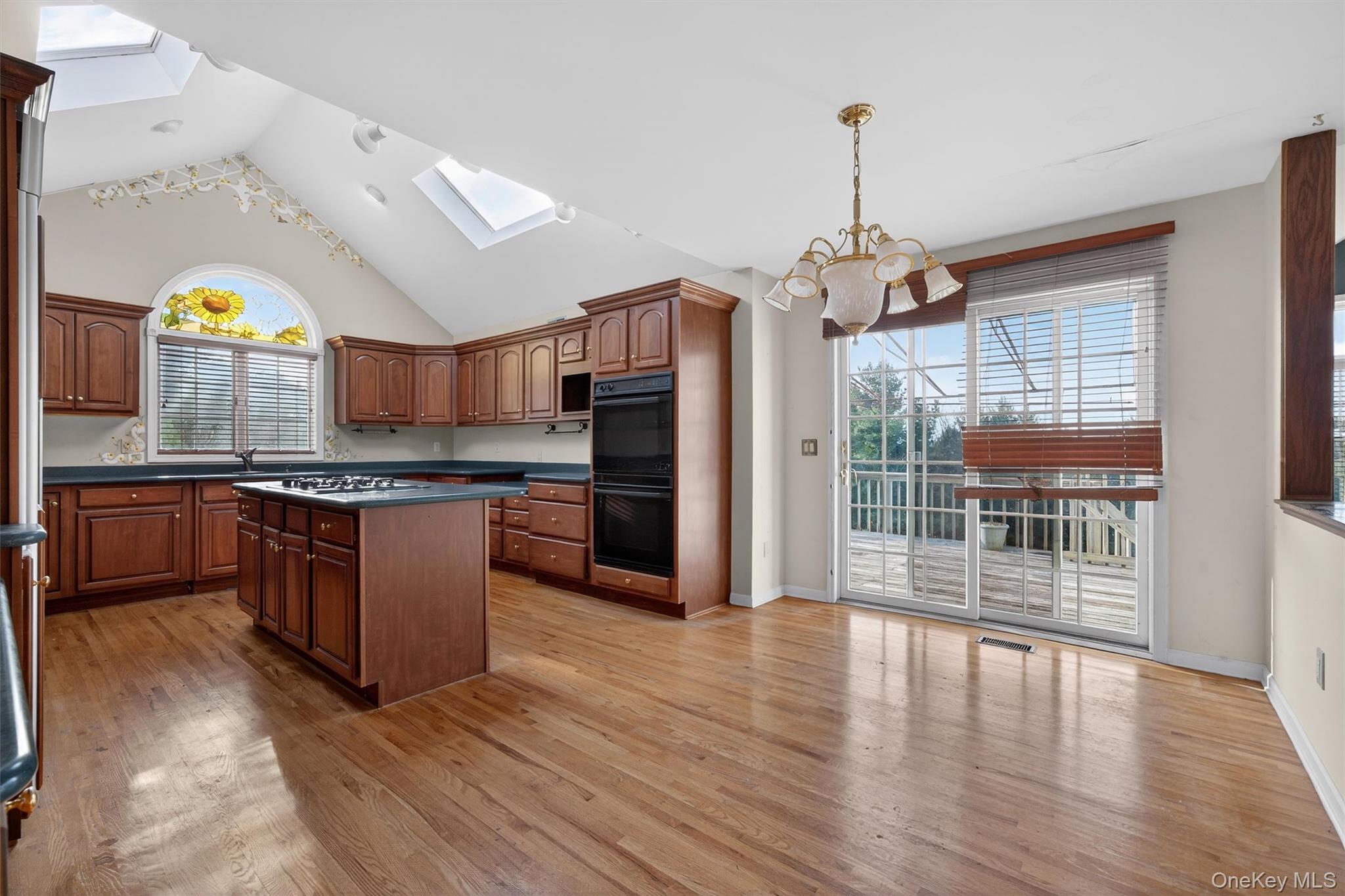 21 Jessup Road Warwick, NY 10990 - Photo 14 of 50 a large kitchen with stainless steel appliances granite countertop a stove and wooden floor