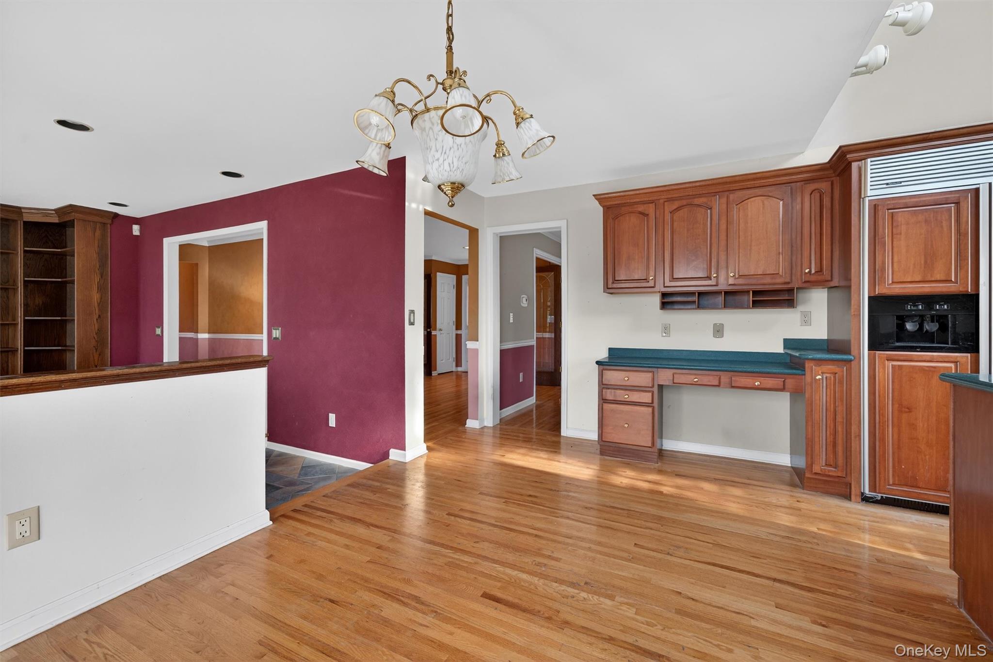21 Jessup Road Warwick, NY 10990 - Photo 15 of 50 a open kitchen with stainless steel appliances granite countertop a stove top oven a refrigerator a sink and dishwasher with wooden floor