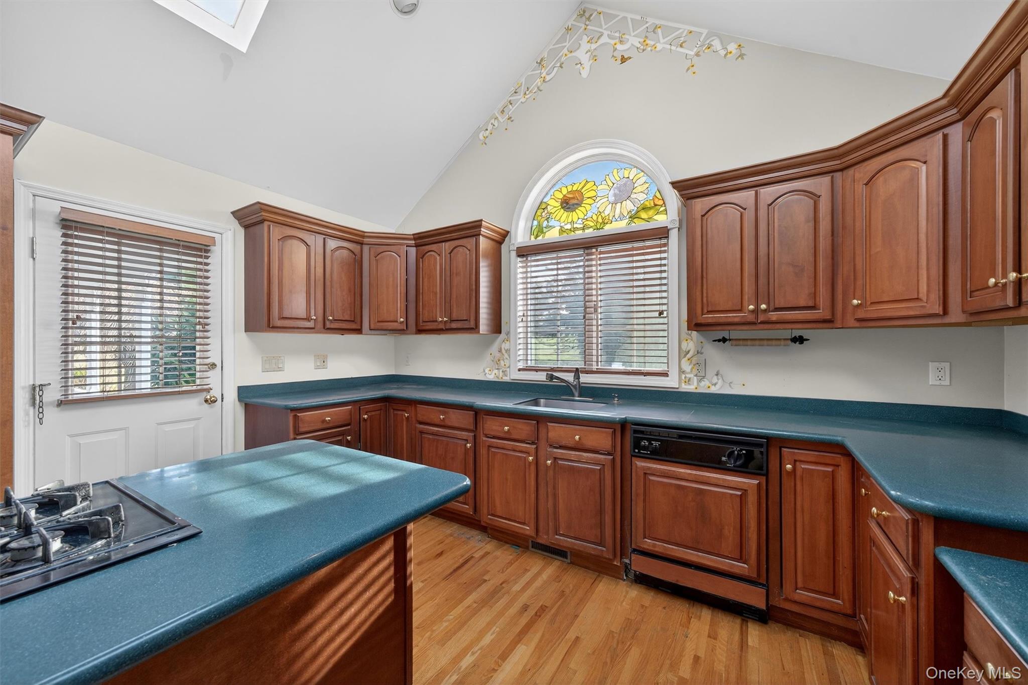 21 Jessup Road Warwick, NY 10990 - Photo 19 of 50 a kitchen with a sink a stove cabinets and wooden floor