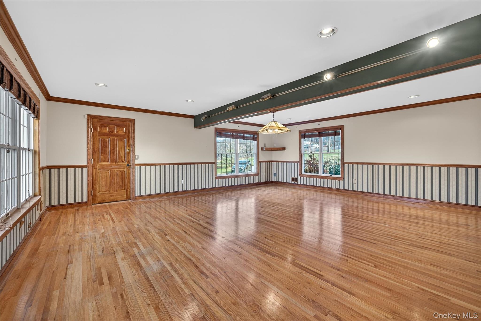 21 Jessup Road Warwick, NY 10990 - Photo 23 of 50 an empty room with wooden floor windows and a rug