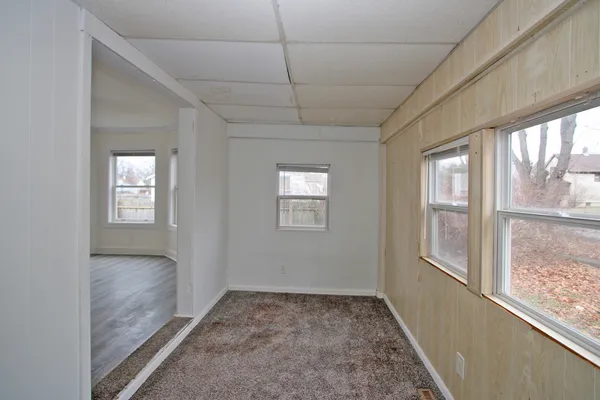 a view of hallway with windows