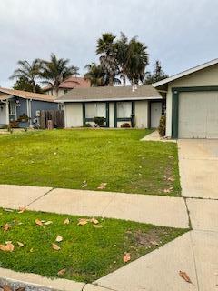 1830 Truckee Way Salinas, CA 93906 - Photo 4 of 17 a front view of a house with a garden