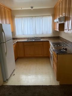 1830 Truckee Way Salinas, CA 93906 - Photo 5 of 17 a kitchen with granite countertop a refrigerator a stove a sink and dishwasher with wooden floor