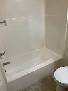 1830 Truckee Way Salinas, CA 93906 - Photo 10 of 17 a bathroom with a toilet and a bathtub