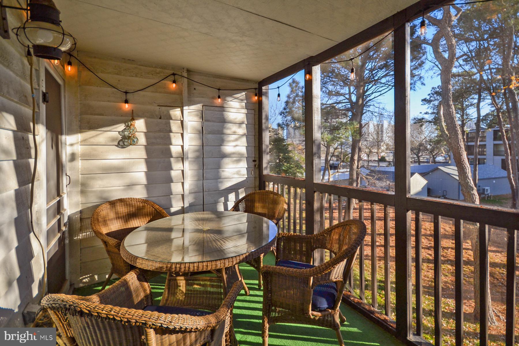 119 Old Landing Road, Unit 204J Ocean City, MD 21842 - Photo 27 of 35 a balcony view with a table and chairs