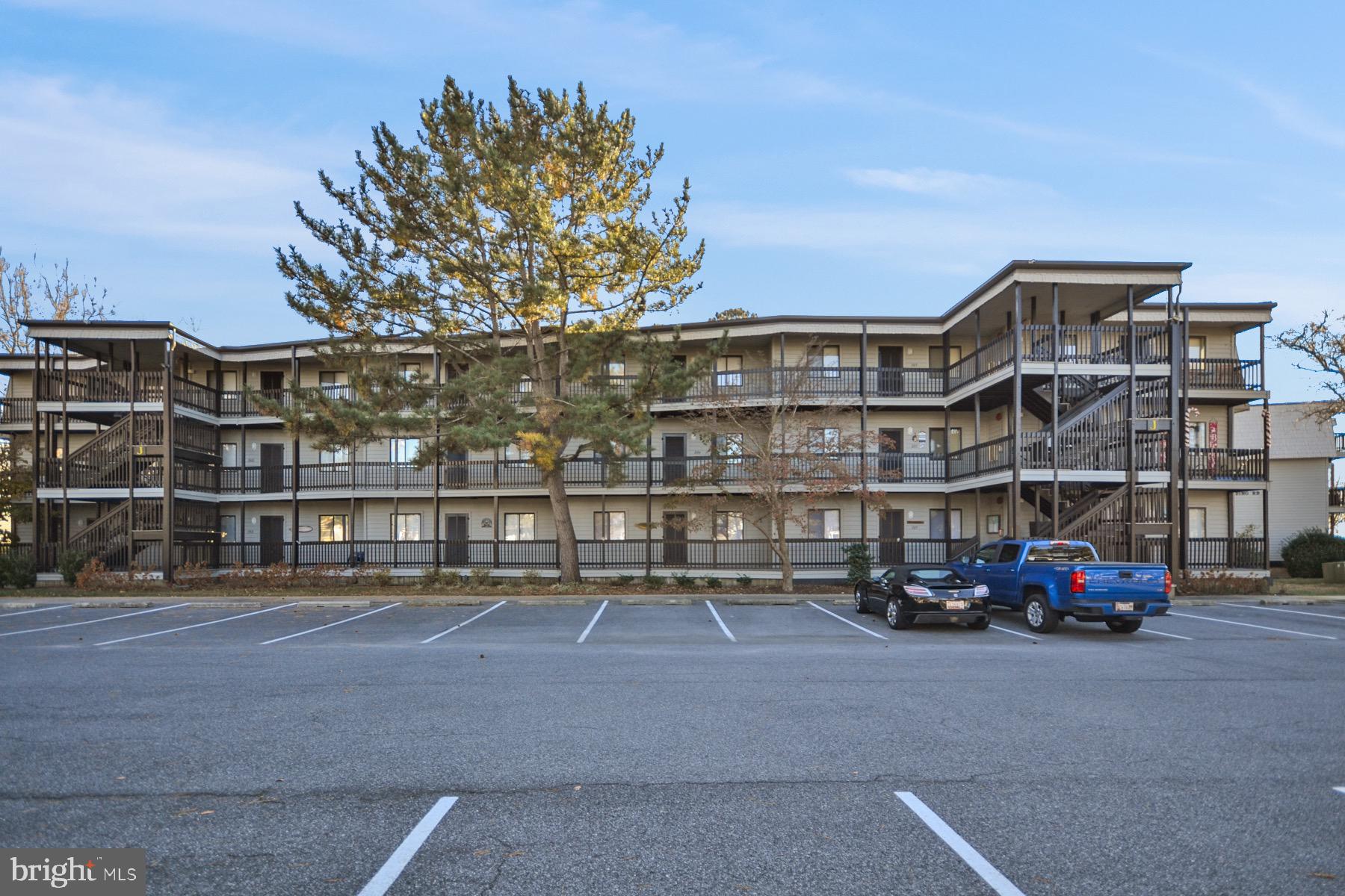 119 Old Landing Road, Unit 204J Ocean City, MD 21842 - Photo 29 of 35 a car parked in front of a building