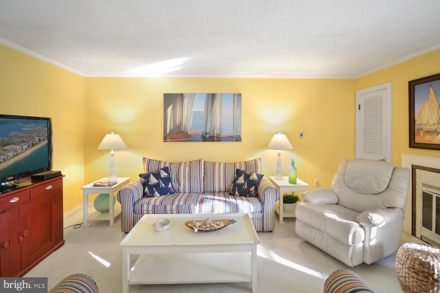 119 Old Landing Road, Unit 204J Ocean City, MD 21842 - Photo 9 of 35 a bedroom with furniture and wooden floor