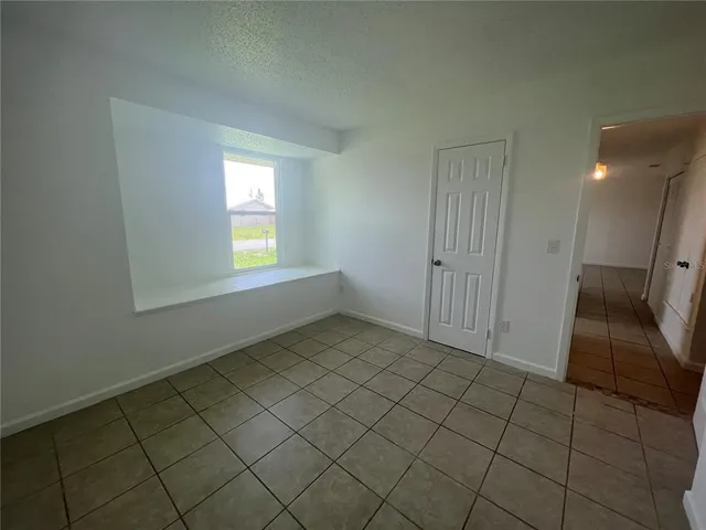 a view of an empty room and window