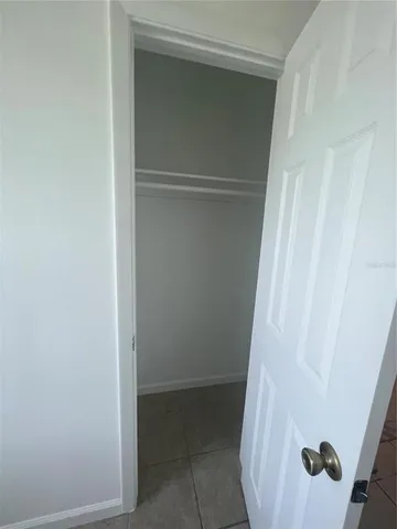 a bathroom with a toilet sink vanity tub and shower