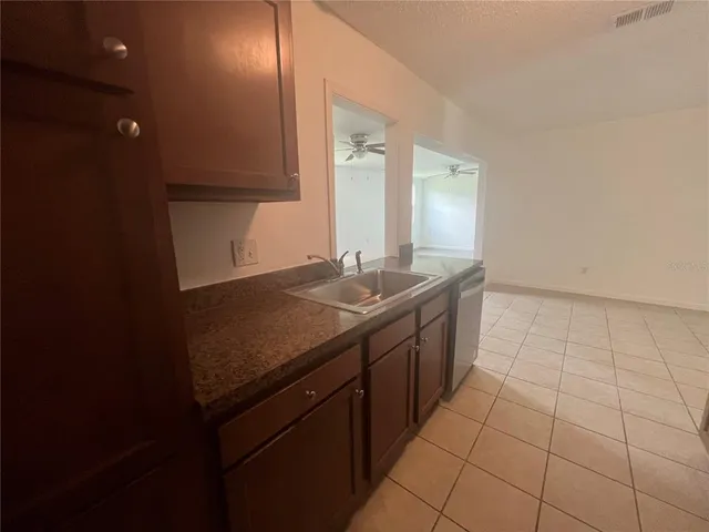 a bathroom with a sink a vanity and a mirror
