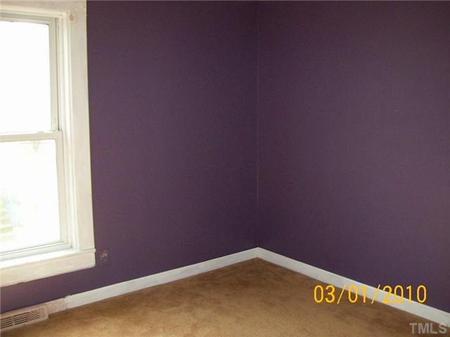 320 Burlington Road Roxboro, NC 27573 - Photo 5 of 12 an empty room with a window