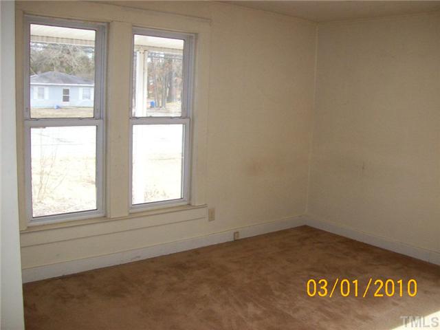 320 Burlington Road Roxboro, NC 27573 - Photo 8 of 12 an empty room with a window