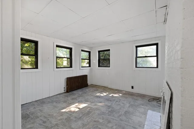 a view of an empty room with windows