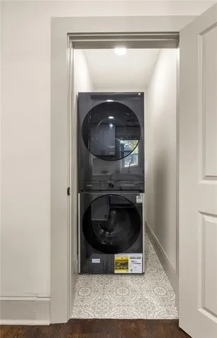 a living room with a fireplace and a rug