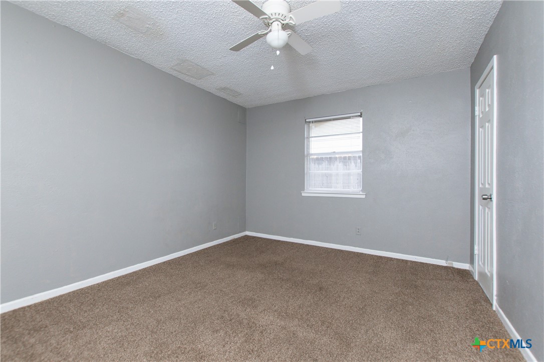 1520 McCarthy Avenue Killeen, TX 76549 - Photo 13 of 23 an empty room with windows and fan