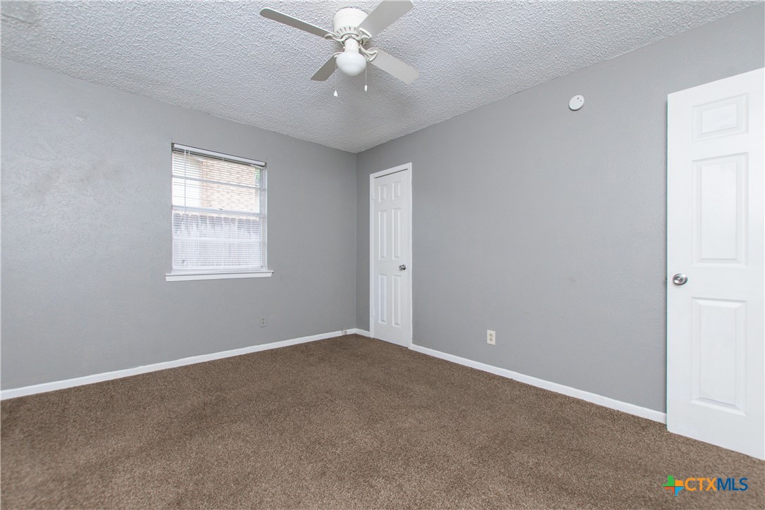 1520 McCarthy Avenue Killeen, TX 76549 - Photo 14 of 23 an empty room with windows and fan