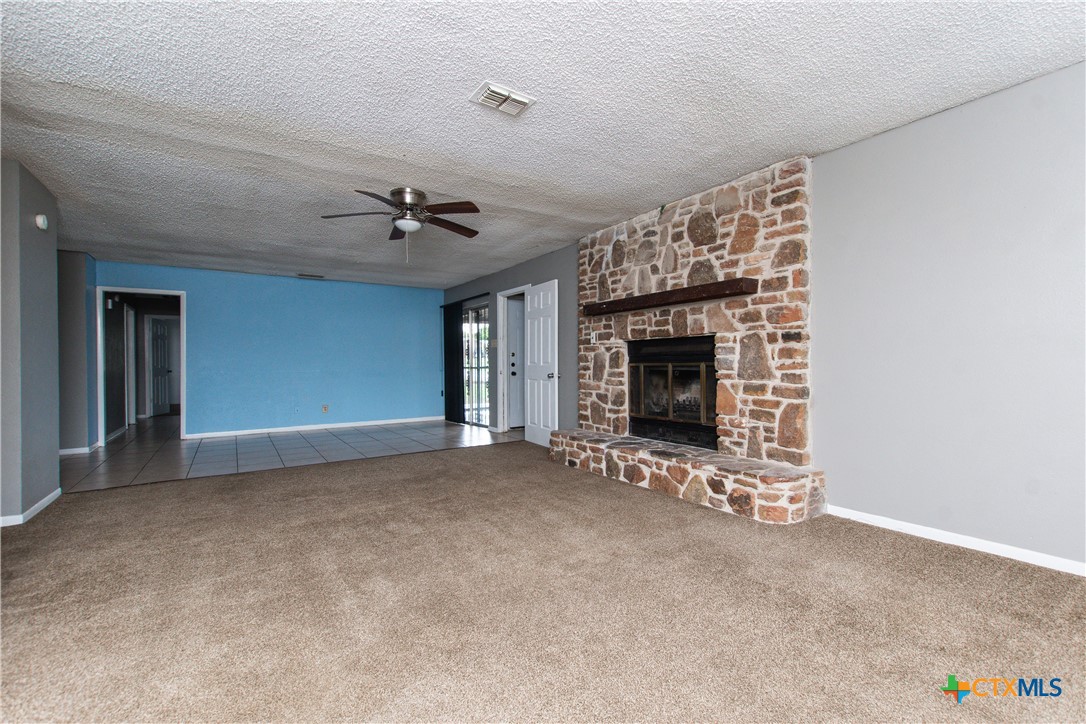 1520 McCarthy Avenue Killeen, TX 76549 - Photo 3 of 23 a view of an empty room with a fireplace