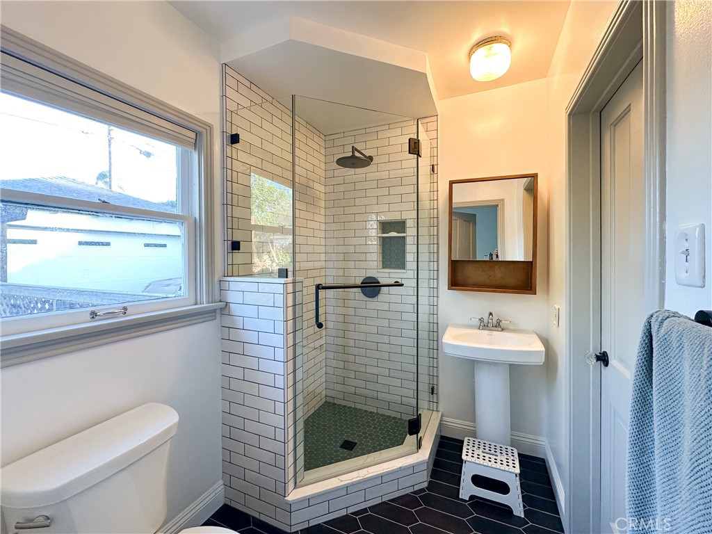 2315 North Flower Street Santa Ana, CA 92706 - Photo 15 of 20 a bathroom with a shower a toilet and a sink