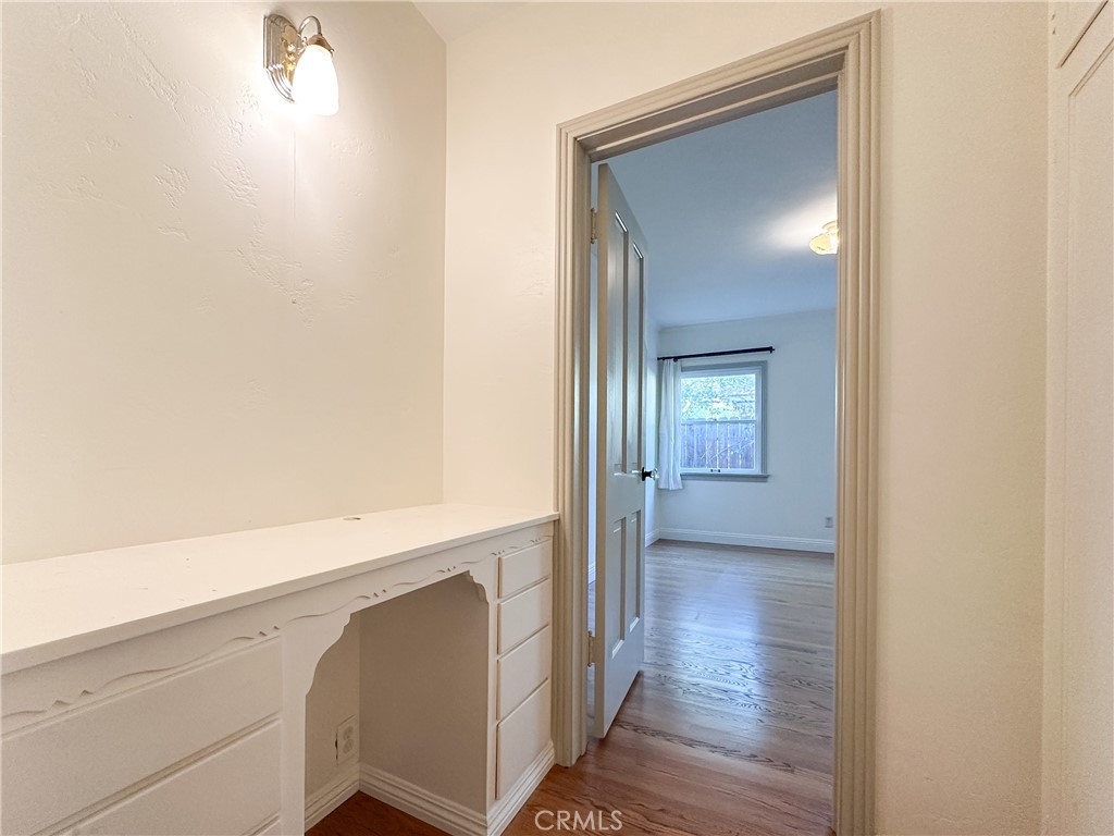 2315 North Flower Street Santa Ana, CA 92706 - Photo 16 of 20 a view of a hallway with wooden floor