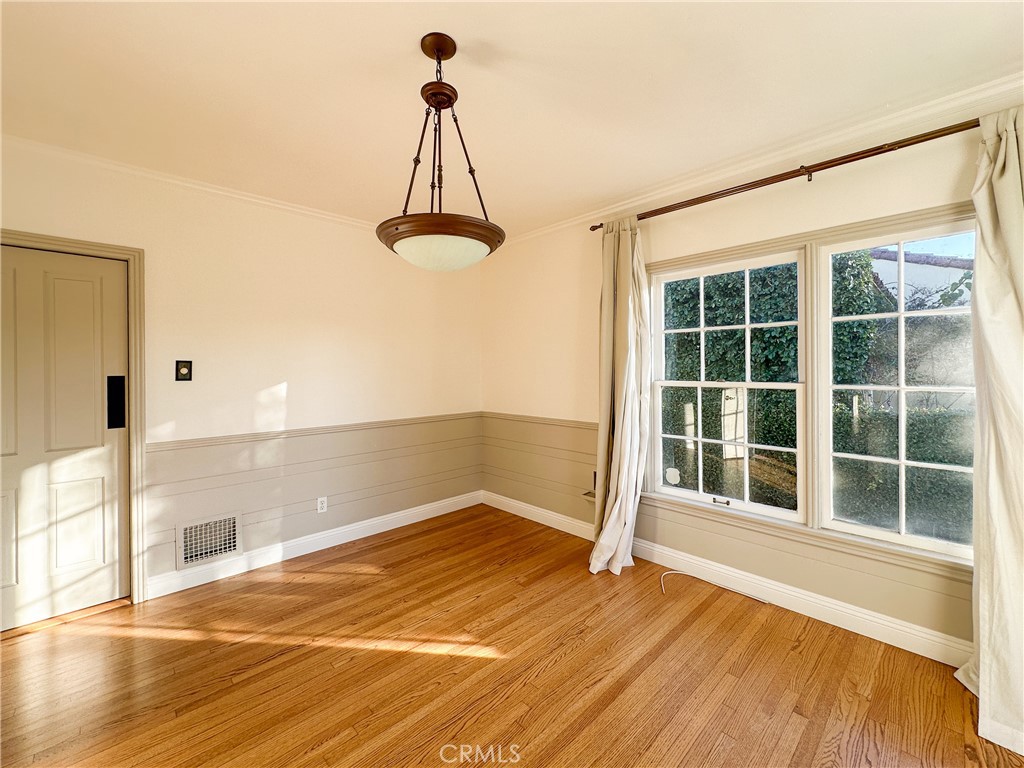 2315 North Flower Street Santa Ana, CA 92706 - Photo 8 of 20 a view of a room with a wooden floor and a window