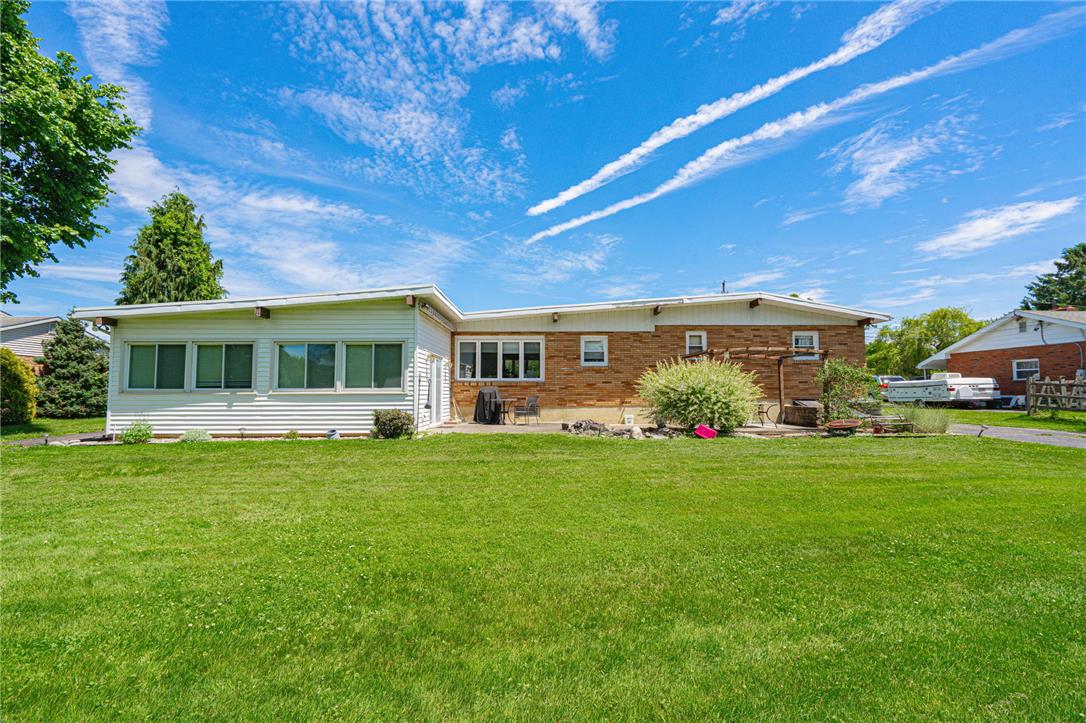 579 Cherry Road Northampton, PA 18067 - Photo 52 of 57 A verdant lawn complements the brick and siding exterior, offering a spacious outdoor retreat.