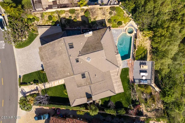 an aerial view of residential houses with outdoor space