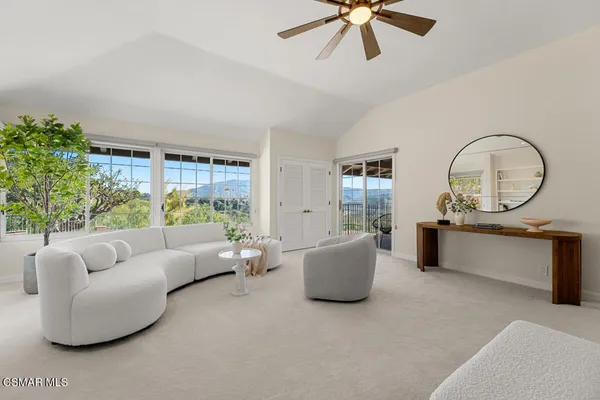 a living room with furniture and a painting