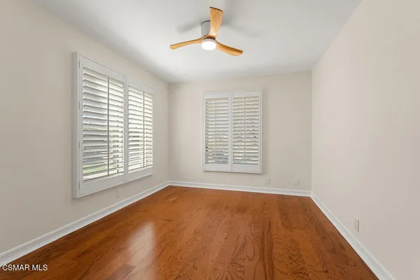 a view of an empty room with a kitchen
