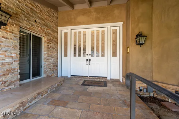a view of a porch with a door
