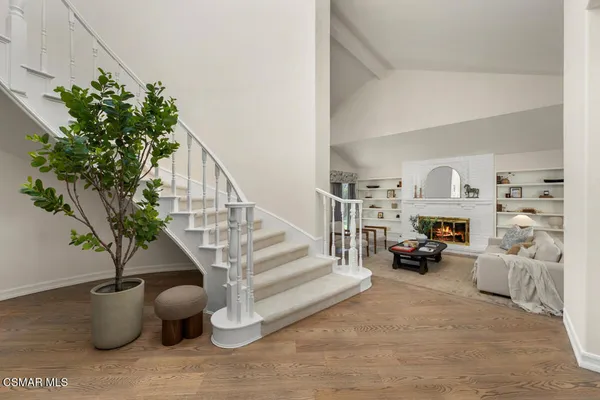 a view of entryway with wooden floor
