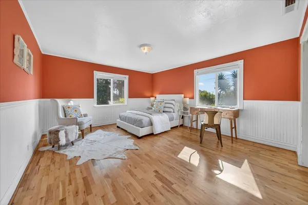 a view of a living room with a table and chairs