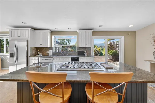 a bathroom with a sink a mirror and a shower