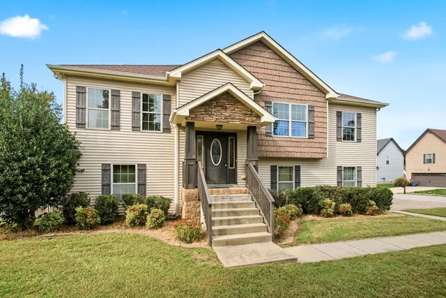 a front view of a house with a yard