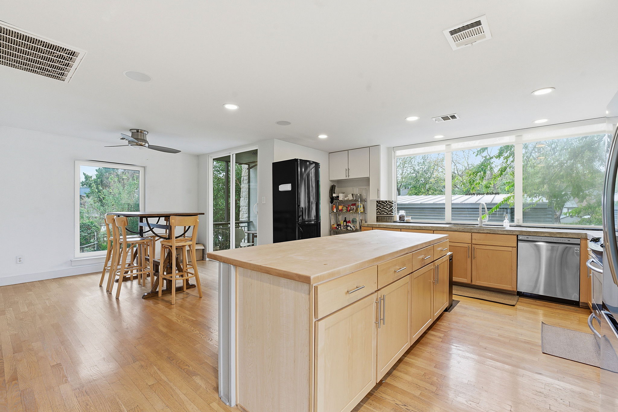616 West Monroe Street Austin, TX 78704 - Photo 4 of 14 a large kitchen with a table and chairs