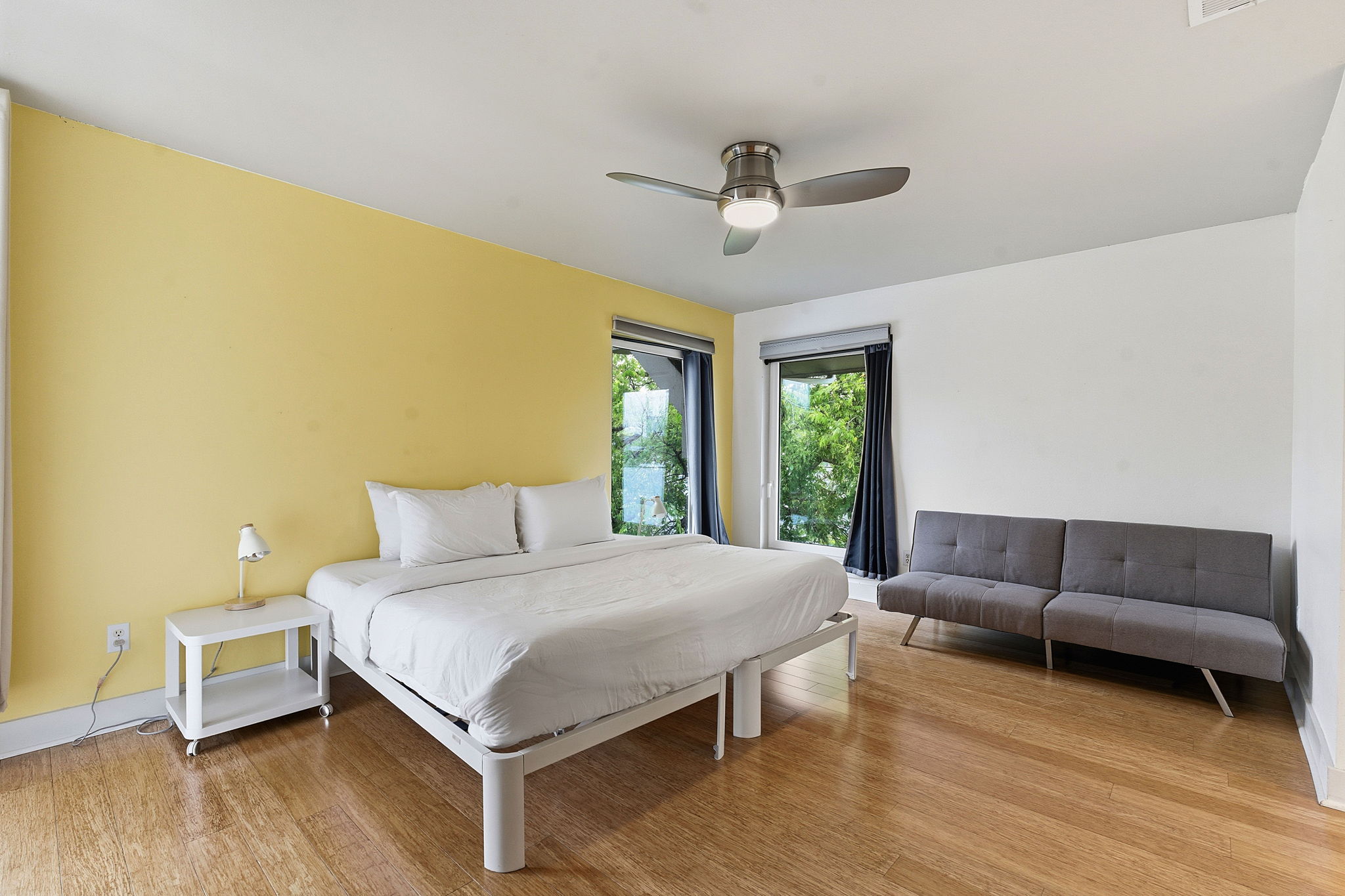 616 West Monroe Street Austin, TX 78704 - Photo 8 of 14 a bedroom with a bed couch and window