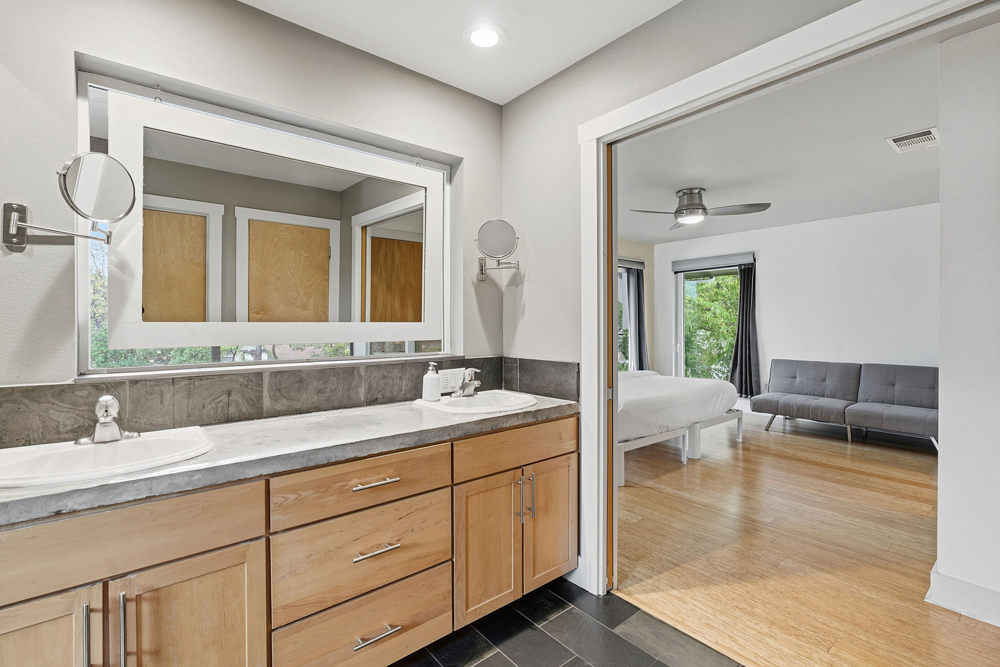 616 West Monroe Street Austin, TX 78704 - Photo 10 of 14 a spacious bathroom with a granite countertop sink mirror and bathtub