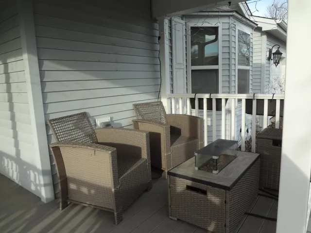 a view of a room that has a couch and a stove