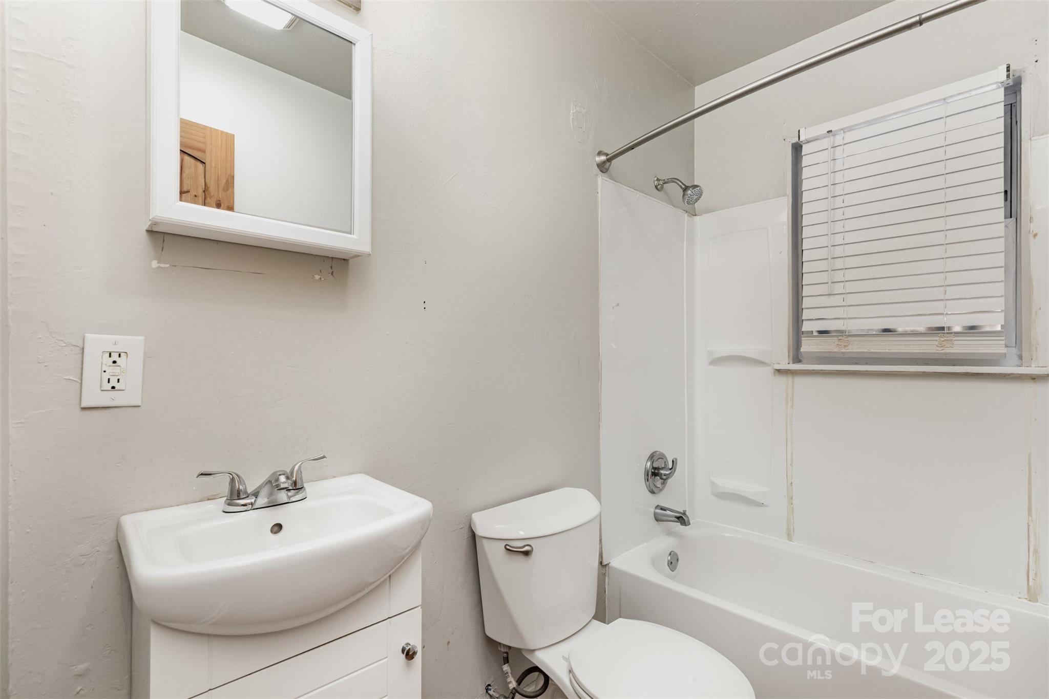 2317 Julia Avenue, Unit 3 Charlotte, NC 28206 - Photo 11 of 12 a bathroom with a sink toilet and shower