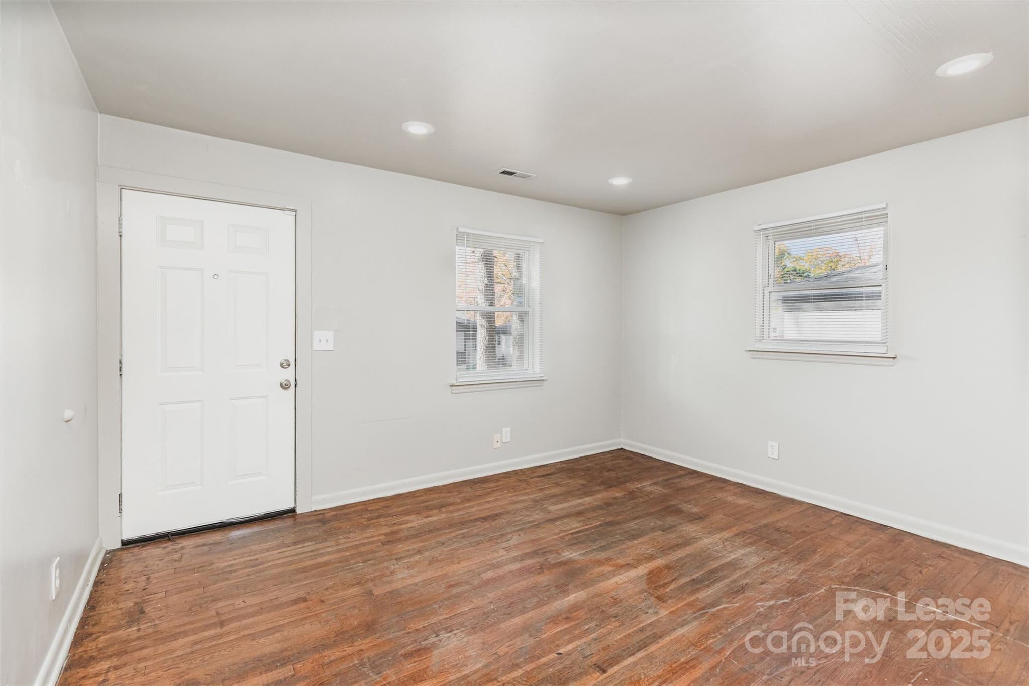 2317 Julia Avenue, Unit 3 Charlotte, NC 28206 - Photo 3 of 12 a view of empty room with wooden floor