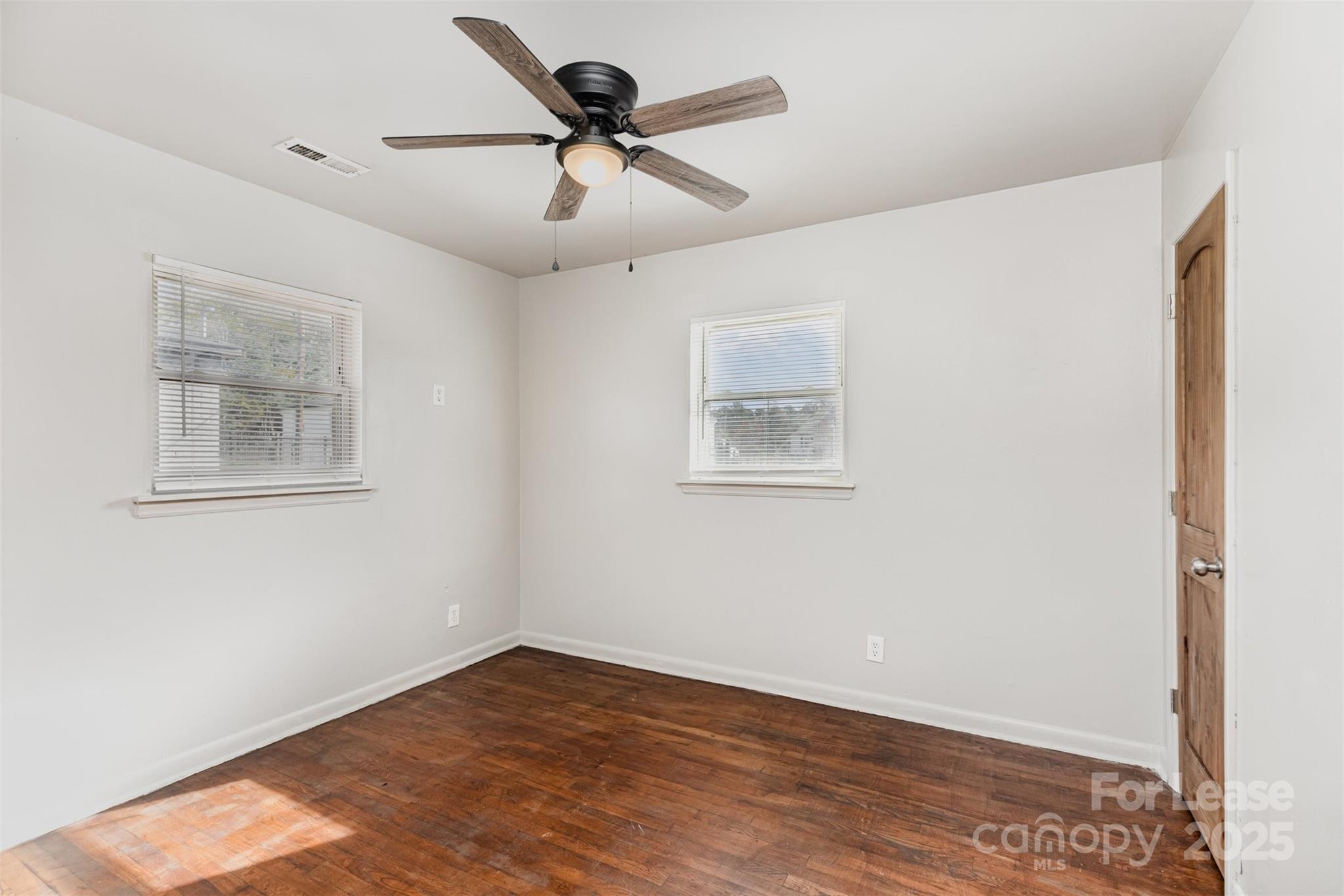 2317 Julia Avenue, Unit 3 Charlotte, NC 28206 - Photo 10 of 12 a view of empty room with wooden floor