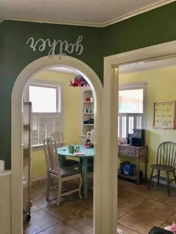 a view of a livingroom with furniture and a window